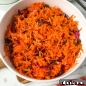 A small image of the shredded carrot salad in a white bowl.