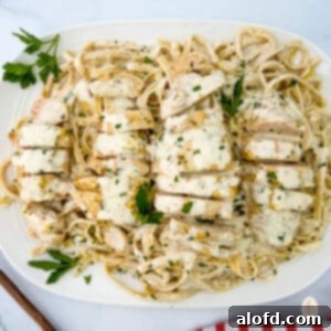 Creamy Garlic Parmesan Chicken Pasta 9 Garlic parmesan chicken pasta on a white serving plate.