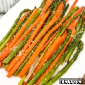 Golden Roasted Carrots and Asparagus 10 A close-up of a serving of roasted carrots and asparagus, highlighting the tender texture and appealing colors.