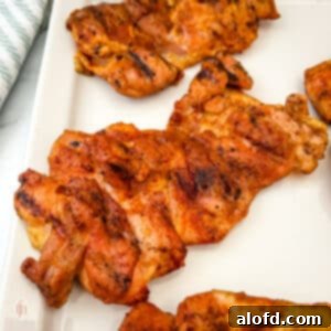 Smoked chicken thighs on a platter.