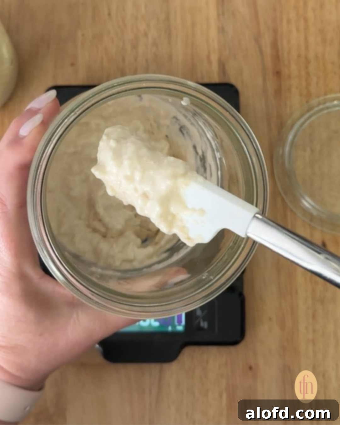 Banish Sourdough Starter Blues 4 Sourdough starter on a Weck jar, scooped using a rubber scrapper.