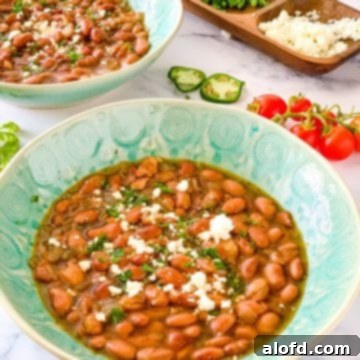 Speedy Instant Pot Pinto Beans 9 pinto beans in bowls with toppings.