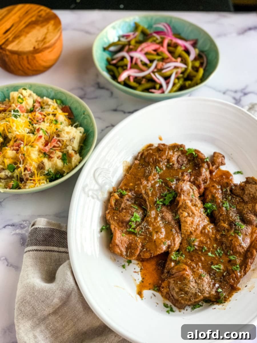 Instant Pot Sour Cream Pork Chops, showcasing the delicious gravy and tenderness.