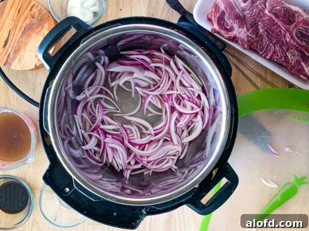 Onions sautéing in the Instant Pot, forming the base of the gravy.