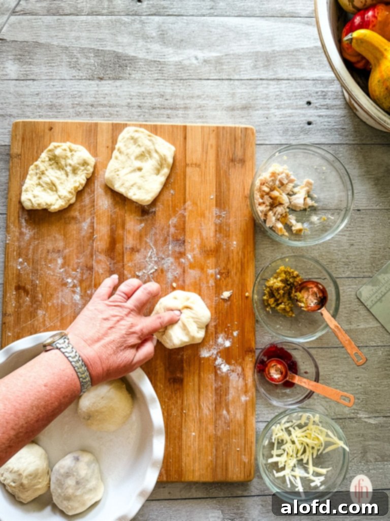 Sealing the stuffed roll before baking.
