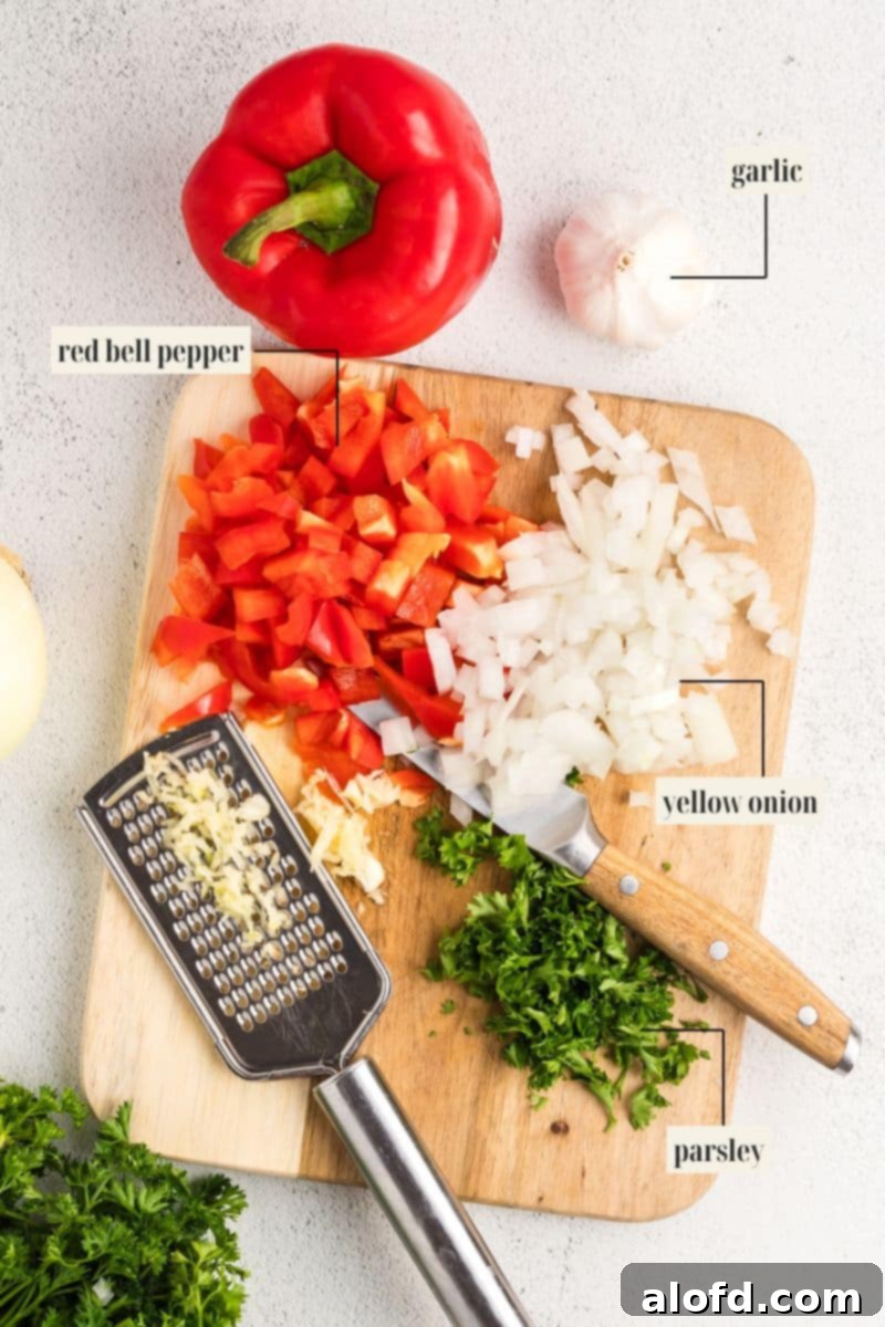 Spicy Rotel Chicken Spaghetti Casserole 5 Individual ingredients for Rotel Chicken Spaghetti laid out and labeled on a kitchen counter.