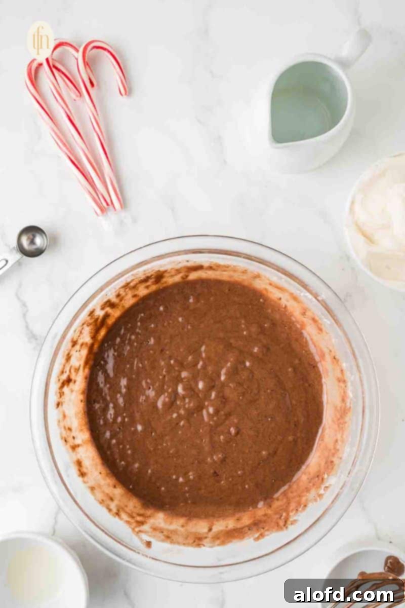 Decadent Peppermint Chocolate Cupcakes 8 Smooth cupcake batter in a glass bowl after mixing.