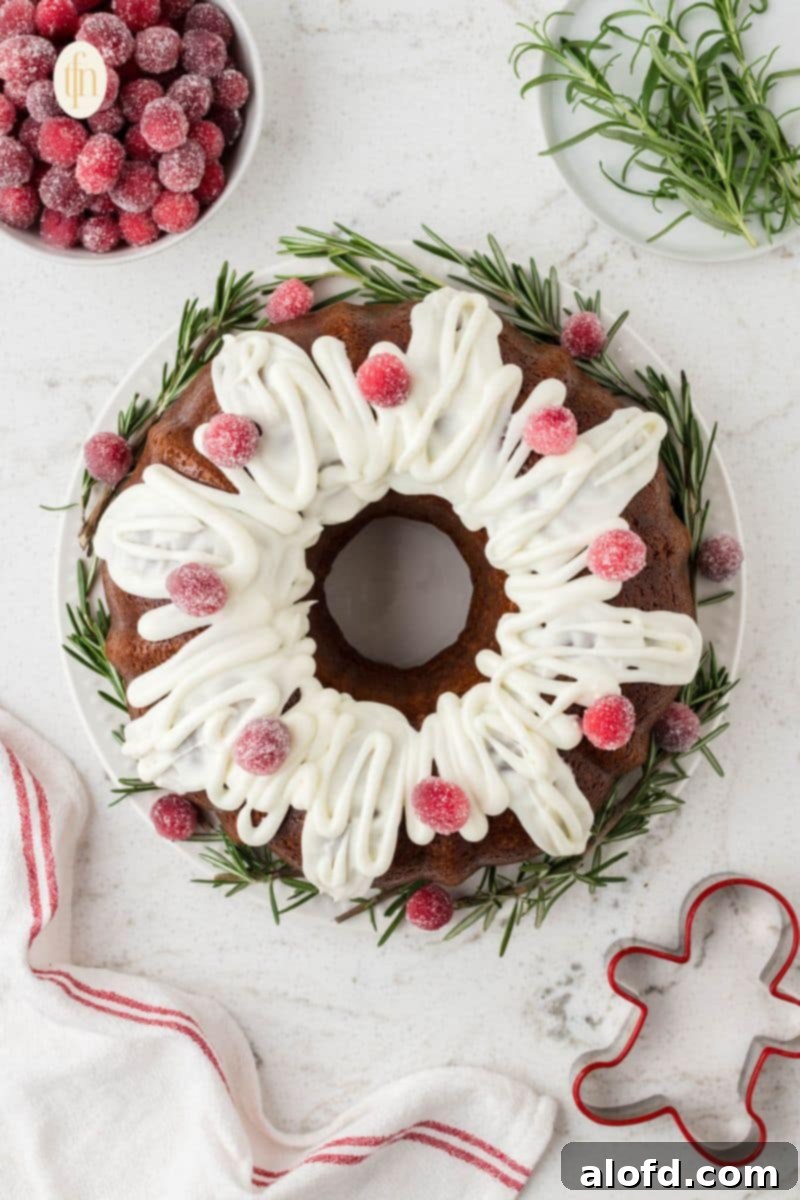Spiced Molasses Bundt Cake 2 A beautifully glazed gingerbread bundt cake, adorned with festive garnishes, presented elegantly on a white serving plate, embodying the spirit of holiday baking.