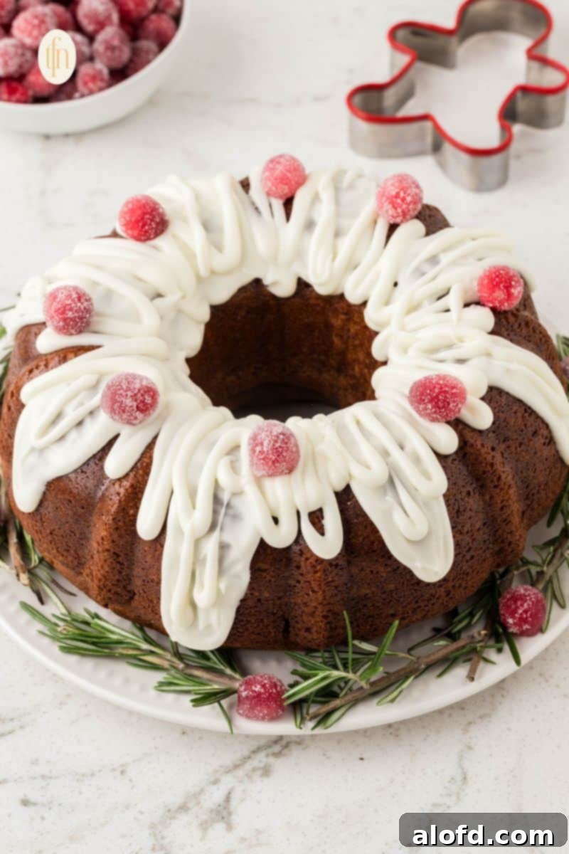 Spiced Molasses Bundt Cake 4 A close-up view of a beautifully glazed gingerbread bundt cake, perfectly shaped and adorned, symbolizing a delectable Christmas dessert.