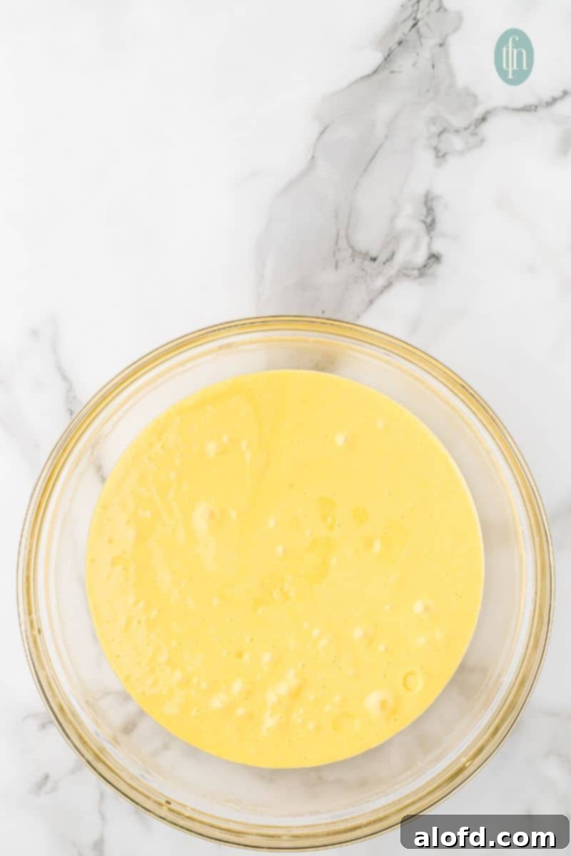 A bowl of yellow batter.