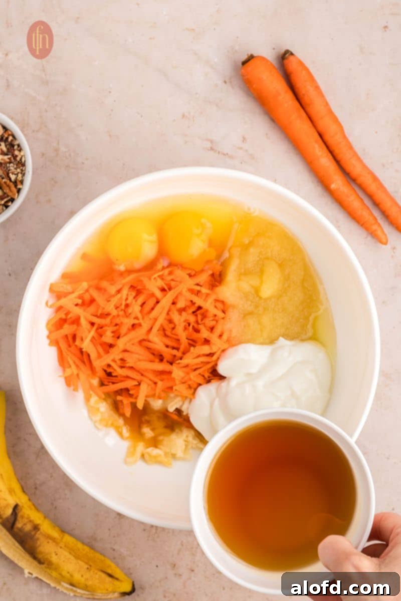 Farmhouse Carrot Cake Loaf 12 A bowl of raw ingredients for batter.