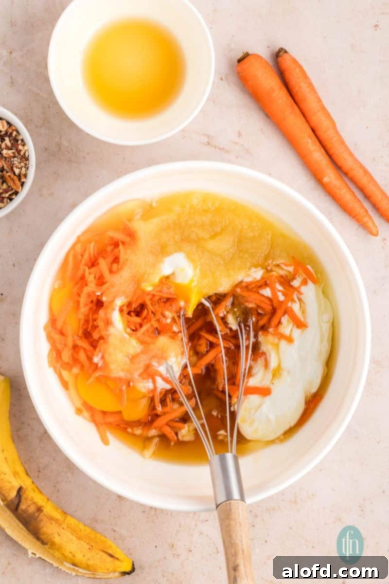Farmhouse Carrot Cake Loaf 13 A bowl of raw ingredients for batter.