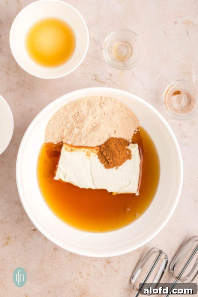 Farmhouse Carrot Cake Loaf 19 Raw ingredients for frosting in a white bowl.