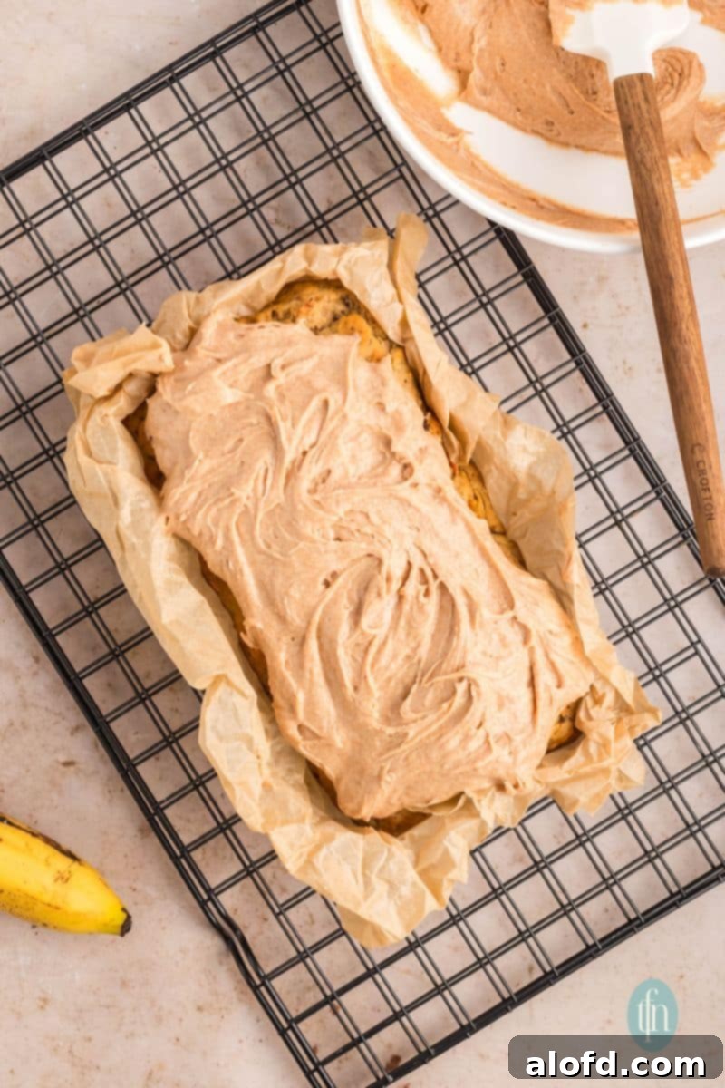 Farmhouse Carrot Cake Loaf 22 A pan of loaf with frosting.