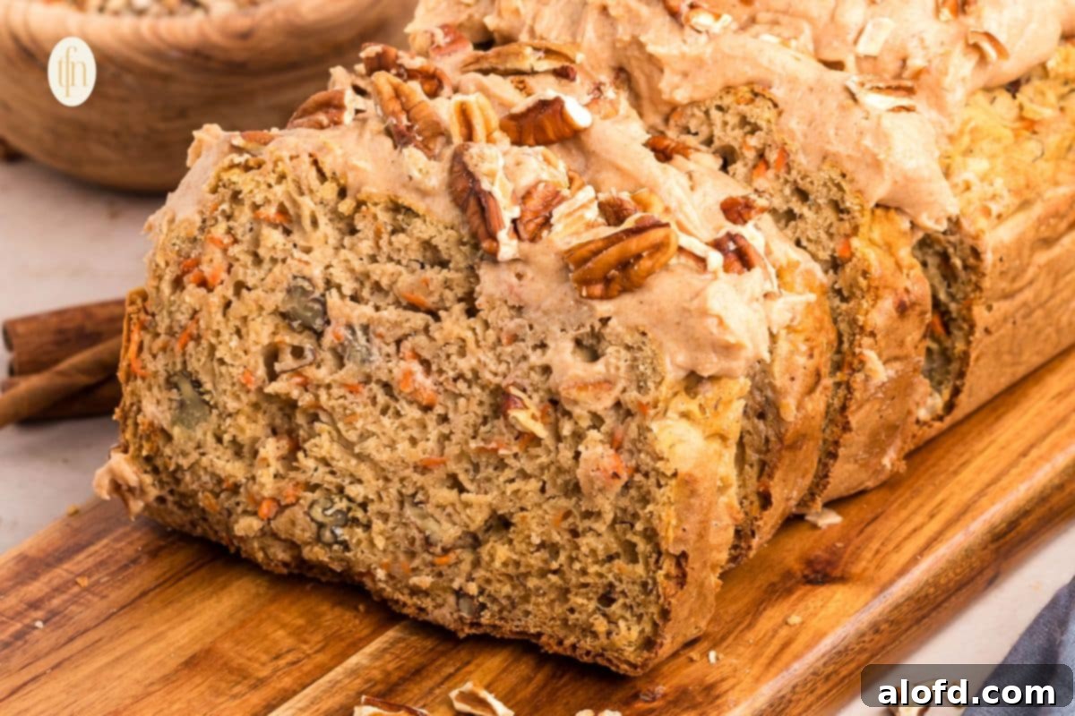 Farmhouse Carrot Cake Loaf 25 carrot loaf on a board.