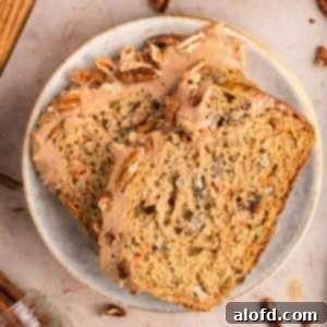 Farmhouse Carrot Cake Loaf 26 Two slices of loaf on a round plate.