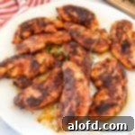 March Flavor Feast: Irresistible Dinner Ideas 24 A beautifully arranged plate of perfectly cooked chicken tenders, ready to be served and enjoyed.