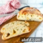 March Flavor Feast: Irresistible Dinner Ideas 27 A hearty loaf of freshly baked jalapeno sourdough bread, showcasing its golden crust and delicious inclusions.