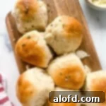 March Flavor Feast: Irresistible Dinner Ideas 28 A close-up shot of a warm batch of pull-apart dinner rolls, glistening with butter and invitingly soft.