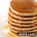 March Flavor Feast: Irresistible Dinner Ideas 8 A tempting stack of golden-brown Bisquick Ultimate pancakes, ready for your favorite toppings.