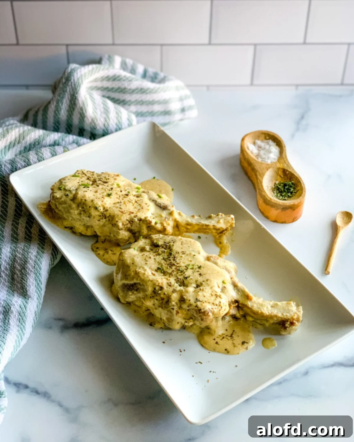 platter of ranch pork chops, ready to serve, a hearty slow cooker pork recipe.