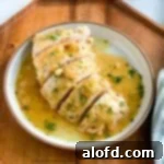 a plate of turkey tenderloin sliced and ready to serve, a perfect foolproof tender turkey dish.