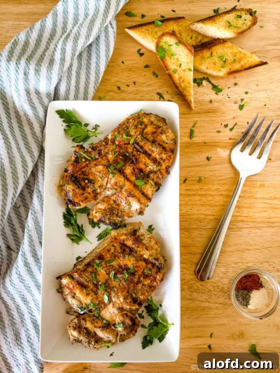Succulent Buttermilk Pork Chops 11 A beautifully arranged platter of grilled buttermilk pork chops, ready to serve.
