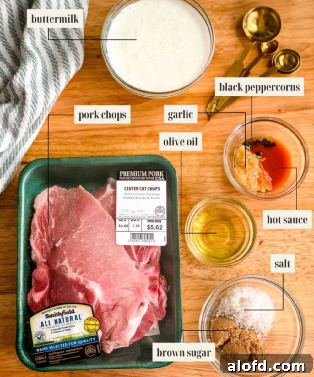Succulent Buttermilk Pork Chops 4 A selection of fresh ingredients including buttermilk, pork chops, garlic, brown sugar, olive oil, and bay leaves laid out for buttermilk pork chops recipe preparation.
