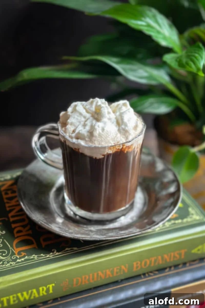 St Patricks Day Feast Ideas 13 A perfectly prepared glass of Irish coffee on a silver plate, ready to be enjoyed.