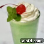 St Patricks Day Feast Ideas 15 A vibrant green homemade shamrock shake in a glass.