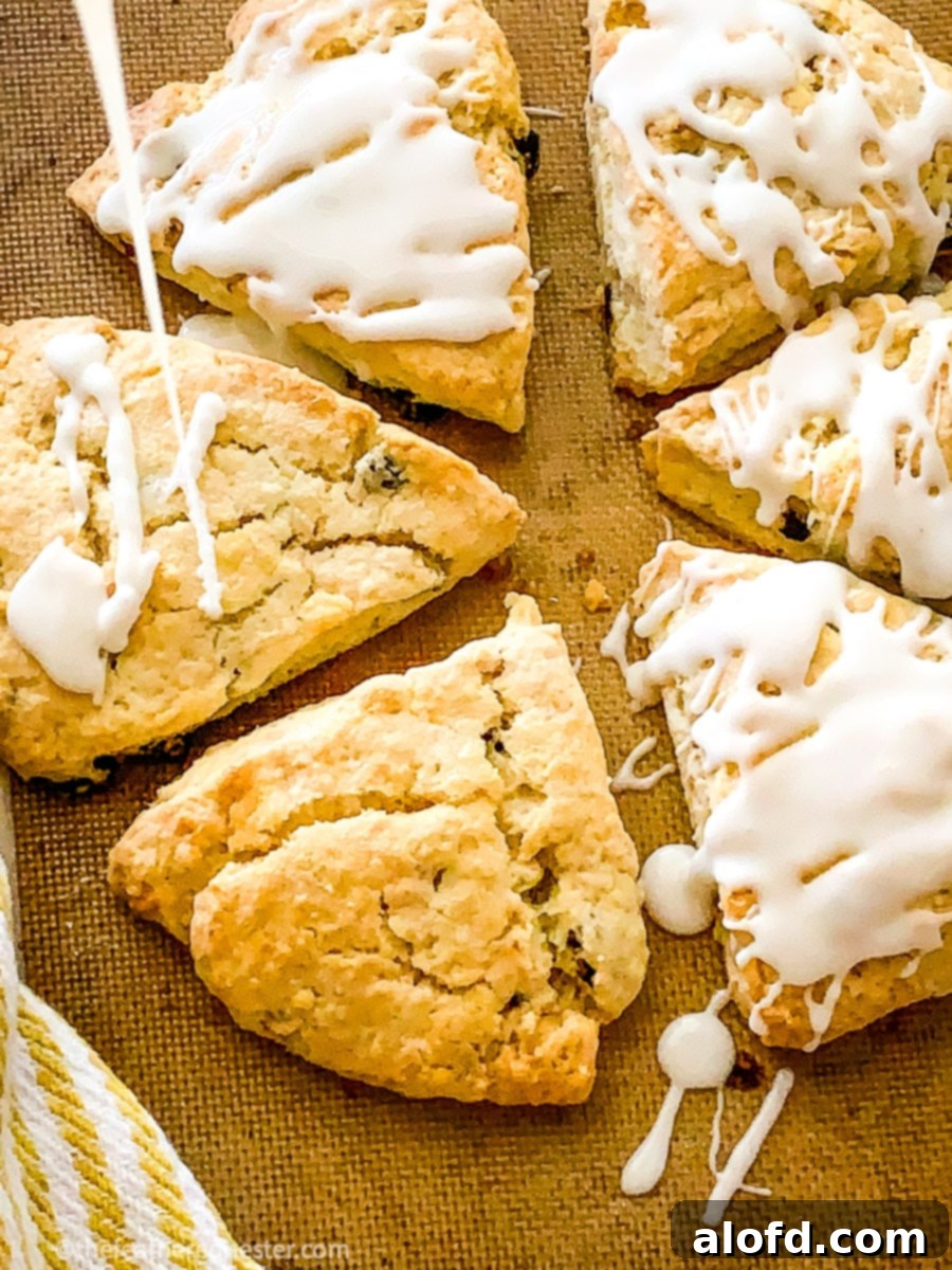 Cut cranberry almond scones arranged on a wooden platter, ready to be served and enjoyed.