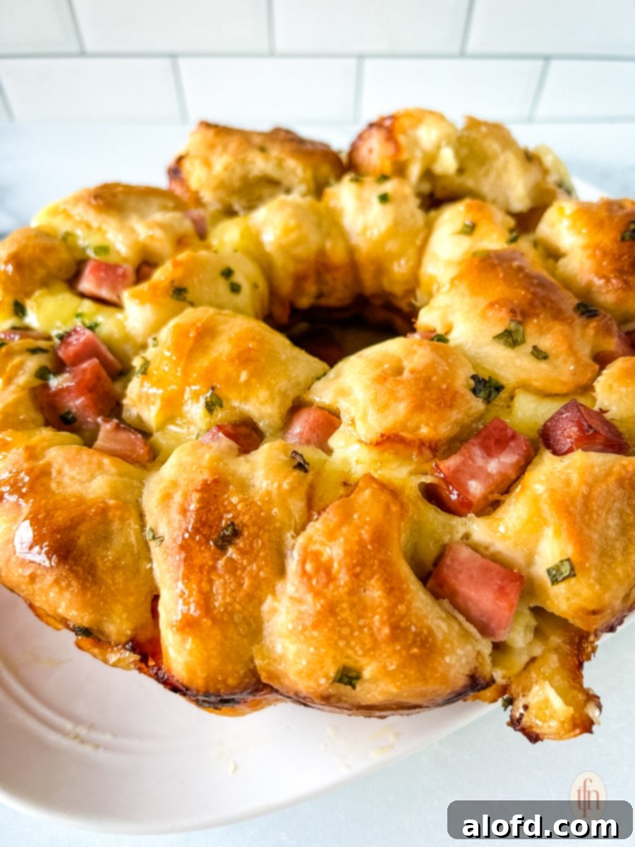 A plate of savory monkey bread with ham and brie, perfect for Easter brunch.