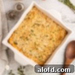 A visually appealing sweet potato casserole, made with canned yams, presented in an elegant white baking dish.