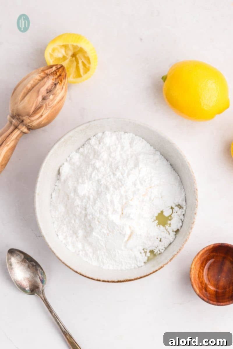 Lemon Blueberry Bliss Bites 16 Powdered sugar in a bowl, ready for glaze making.