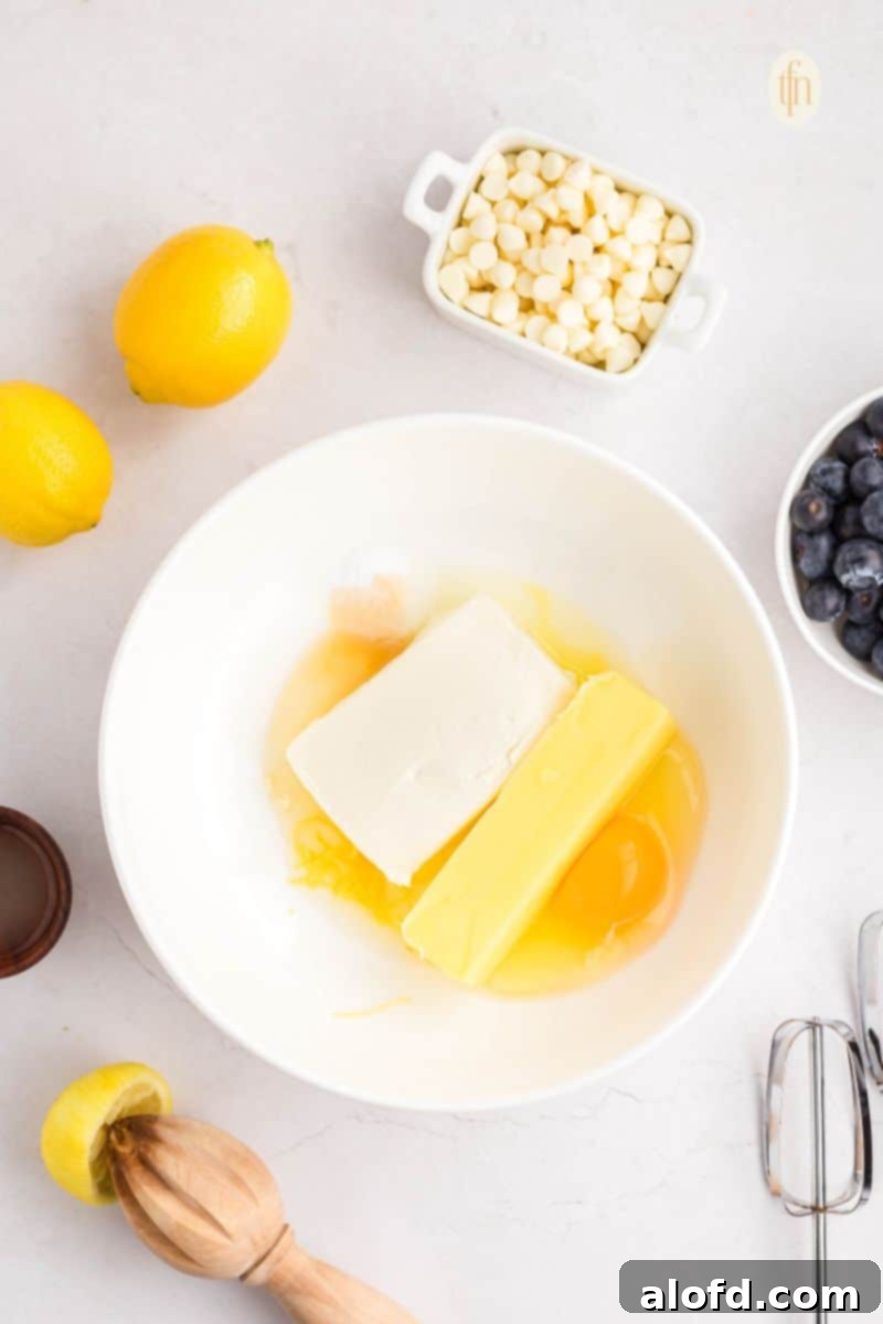 Lemon Blueberry Bliss Bites 7 Raw ingredients in a bowl before mixing for cake mix cookies.