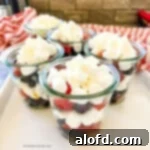 Light and Vibrant Spring Dinners 30 Small cups filled with mini marshmallows and red and blue berries.