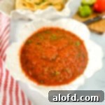 Small white dish of jalapeno salsa.