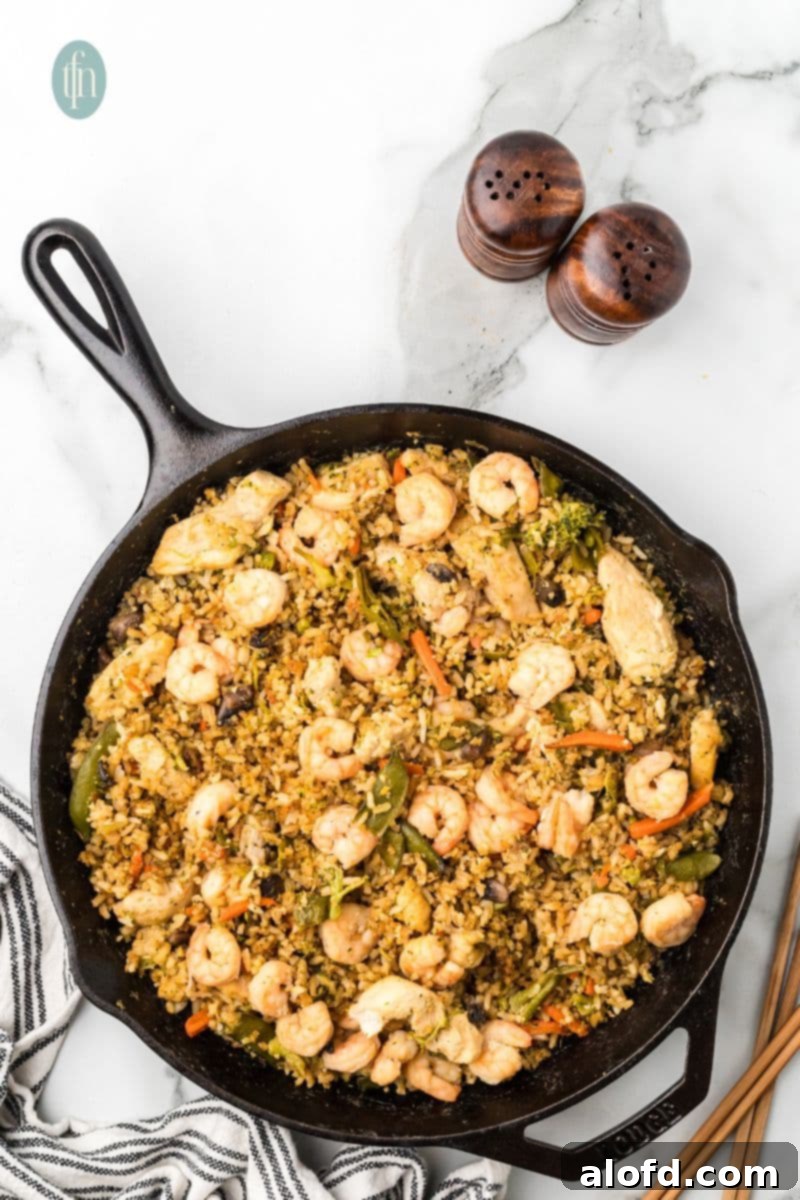 Surf and Turf Fried Rice 15 A large skillet of shrimp and chicken fried rice, perfectly cooked and glistening.