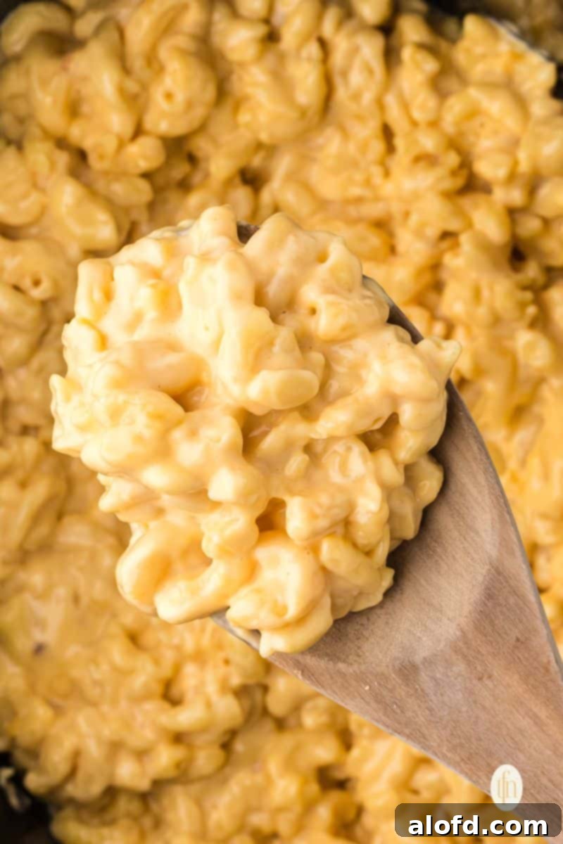 A large scoop of Velveeta mac and cheese, ready to be served.