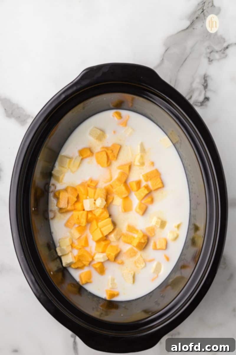 Crockpot with macaroni mixture cooking.