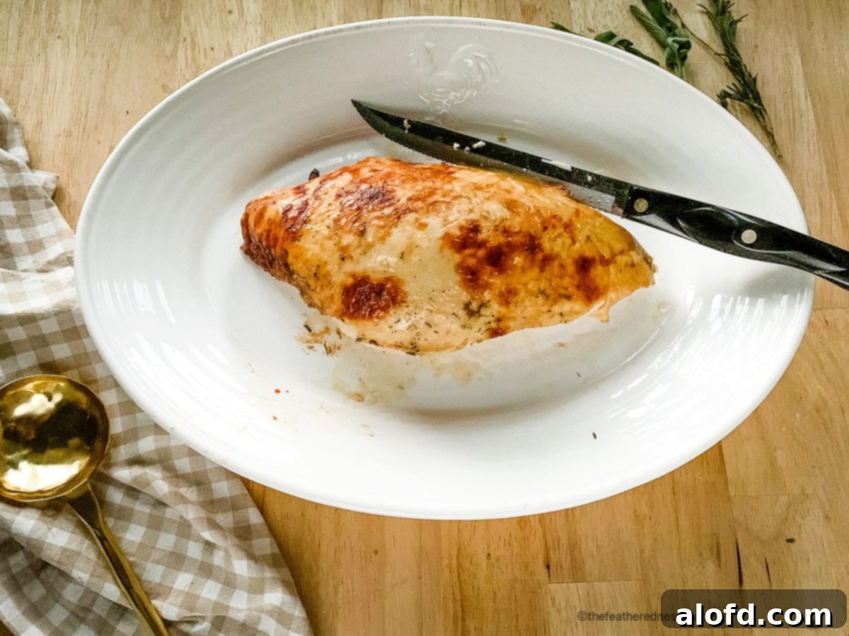 Tender Buttermilk Turkey Breast 8 A large serving platter holding a fully roasted, golden-brown turkey breast, garnished and ready for carving and serving.