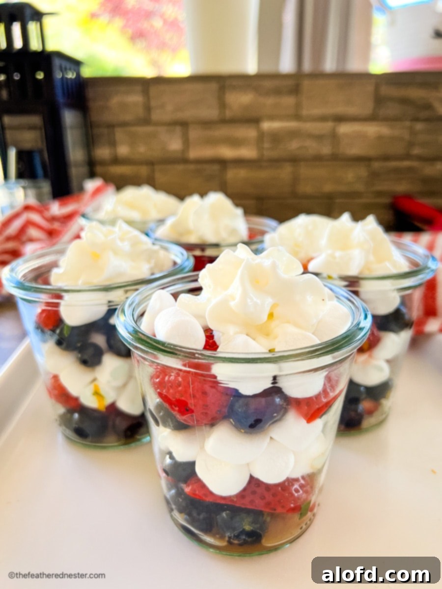 Red white and blue salad in small glass cups.