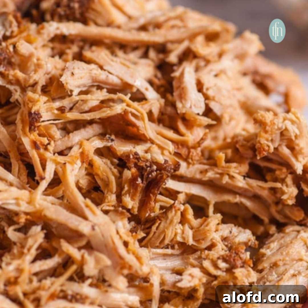 Fall-Apart Slow Cooker Pot Roast 2 Close up of perfectly shredded chuck roast, showcasing its tender texture.