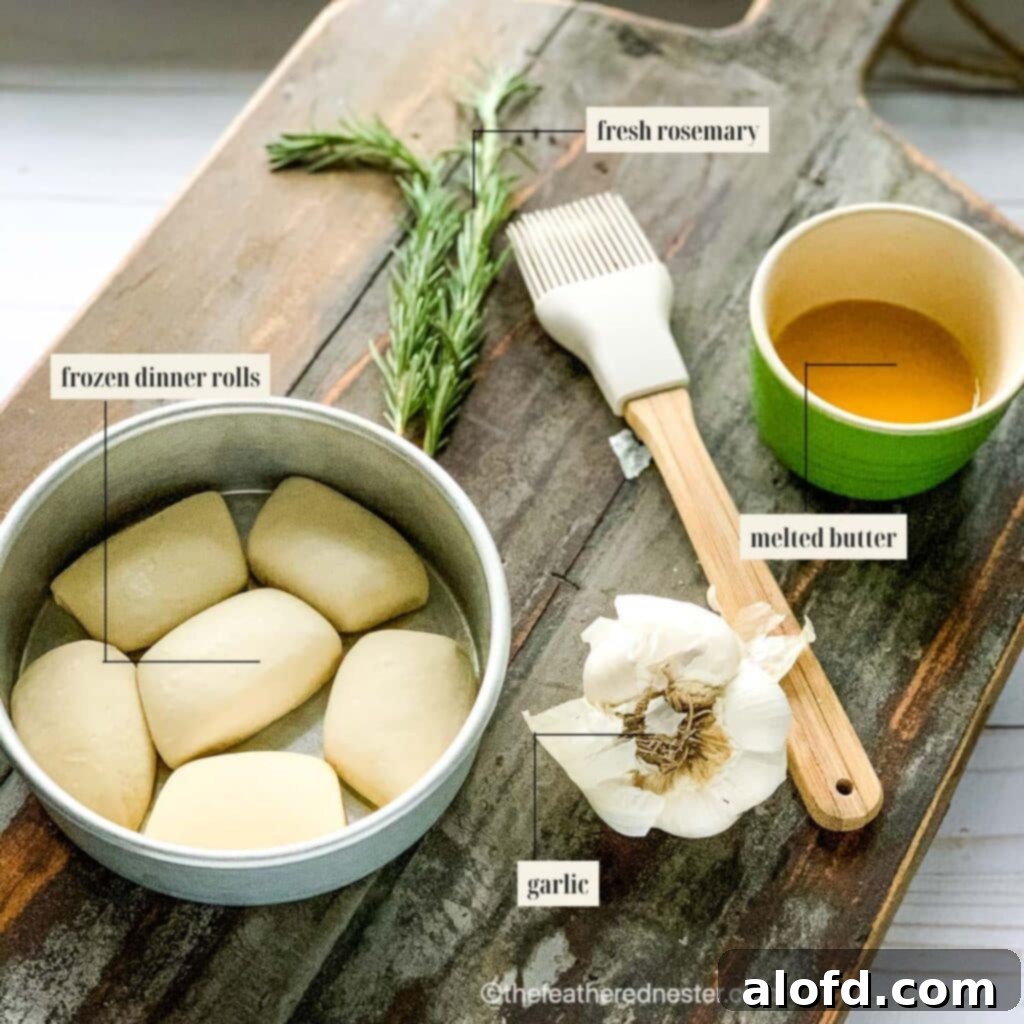Labeled ingredient image for garlic dinner rolls recipe, showing frozen rolls, butter, fresh garlic, and rosemary ready for preparation.