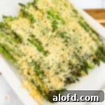 Asparagus casserole on a white serving plate.