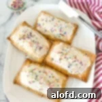 a plate of frosted blueberry hand pies.