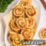 Ham and cheese pinwheels on a serving platter.