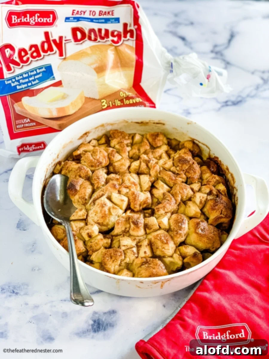 Bridgford Ready-Dough apple fritter breakfast casserole bake shown in a baking dish, golden brown and bubbly, ready for serving.