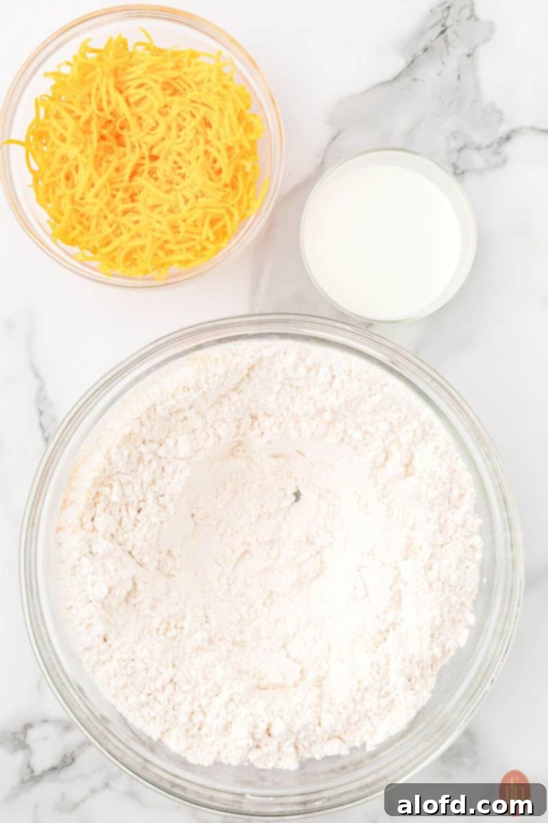 Cheddar Bliss Bites 6 Adding cheese and milk to the mixture