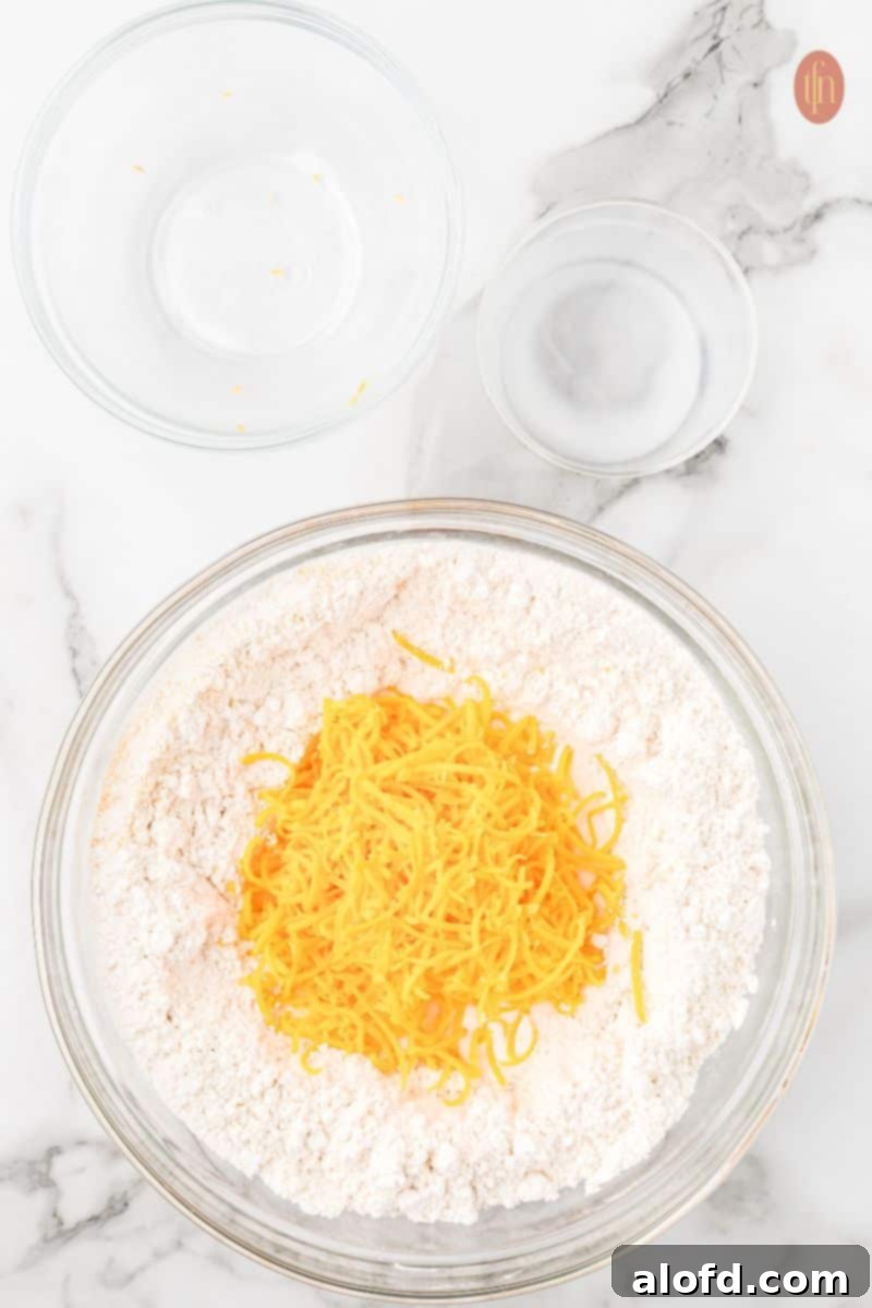 Cheddar Bliss Bites 7 Dry ingredients and cheese in bowl